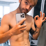බි