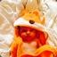 a baby in a fox towel