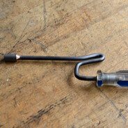 Nut driver with a bent shaft