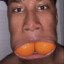 Dude With 2 Oranges In His Mouth