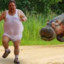 scared man running from hippo