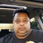 sun shining on indian man in car