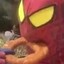 Spider Man eating an onion ring