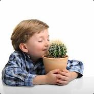 A Small Child Smelling A Cactus