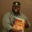 Negro Holding A Box Of Cheerios