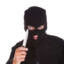 man in balaclava holding knife