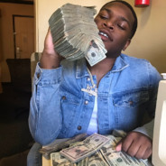 BLACK BOY HOLDING A STACK