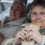 Two old people enjoying a pasty