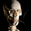 esqueleto qlo fumando porro
