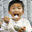 Asian kid eats rice ツ