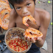 SMALL boy eating BIG shrimp